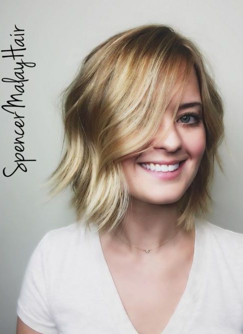 Beachy blonde wavy layered bob haircut