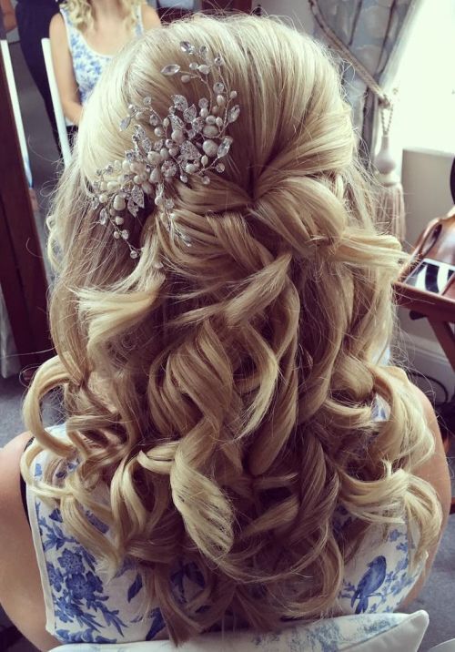 Half up half down hairstyle with hair accessory