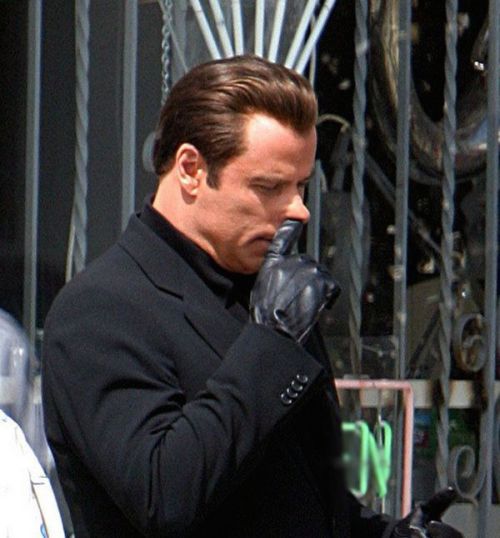 John Travolta picking nose