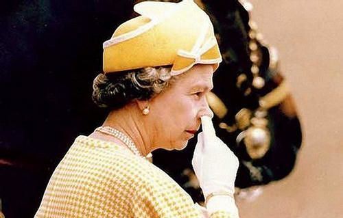 The Queen picking nose