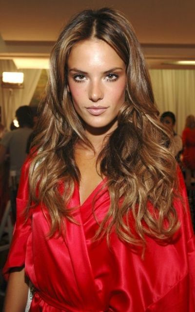 Latte-brown hair color on long curly hairstyle