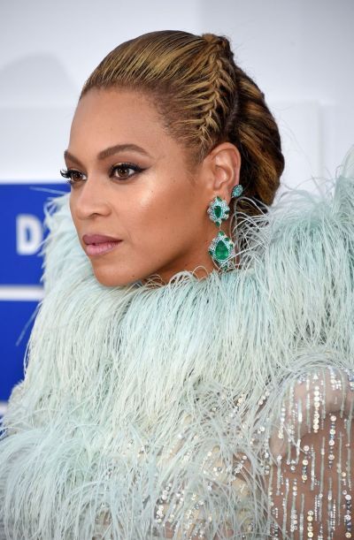 Tight swept back crown braid updo with brownish blonde hue