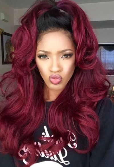Vibrant burgundy hair color on a high ponytail hairstyle