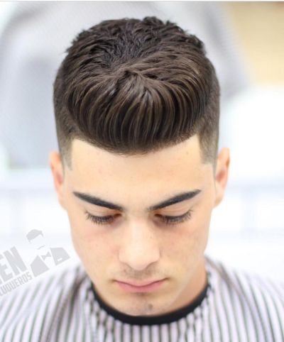 Centered pompadour with taper fade