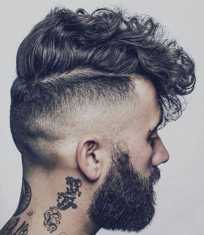 Front combed curly hair with high fade