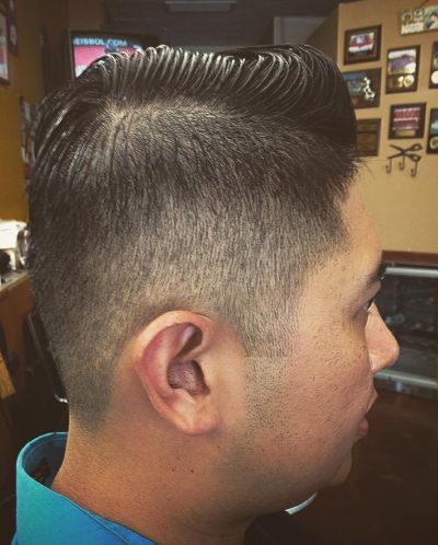 Slick side part with buzz fade
