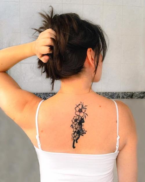 cat flower back tattoo meaning