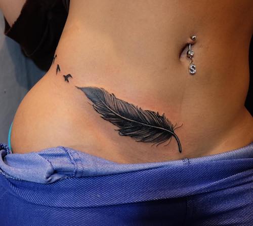 waist feather birds tattoo meaning