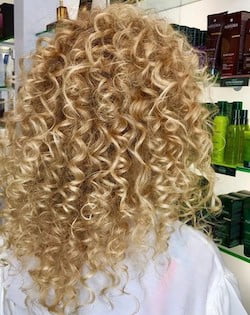 She wrapped a T-Shirt over her wet hair overnight, then WOW!