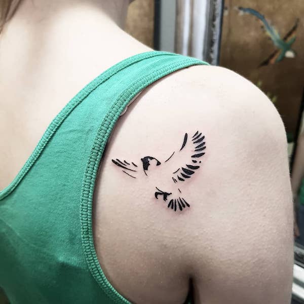 flying bird shoulder blade tattoo