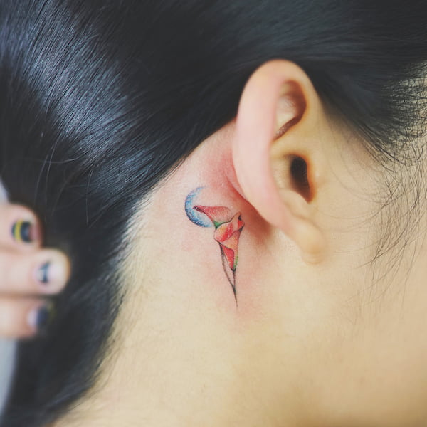 calla lily behind ear tattoo