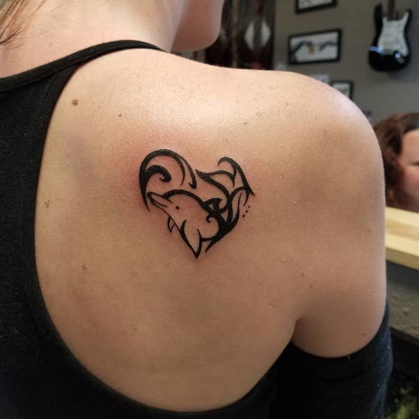 dolphin heart shoulder blade tattoo