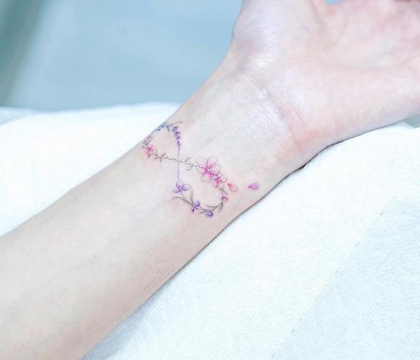 Floral infinity wrist tattoo