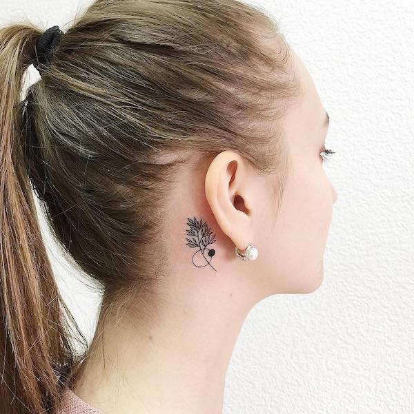 vine behind ear tattoo
